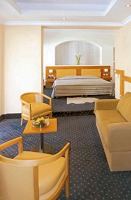 A room with sitting area in the Athens Cypria hotel