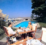 Nafplia Palace in Nafplion; the main restaurant and the swimming pool