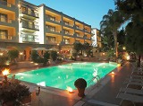 Night view of the hotel and its pool