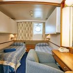 'XA' outside quadruple cabin with porthole