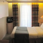 Outside Deluxe cabin with balcony (B): double bed and upper bunk