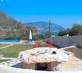 Partial view of the villa, its gardens and pool